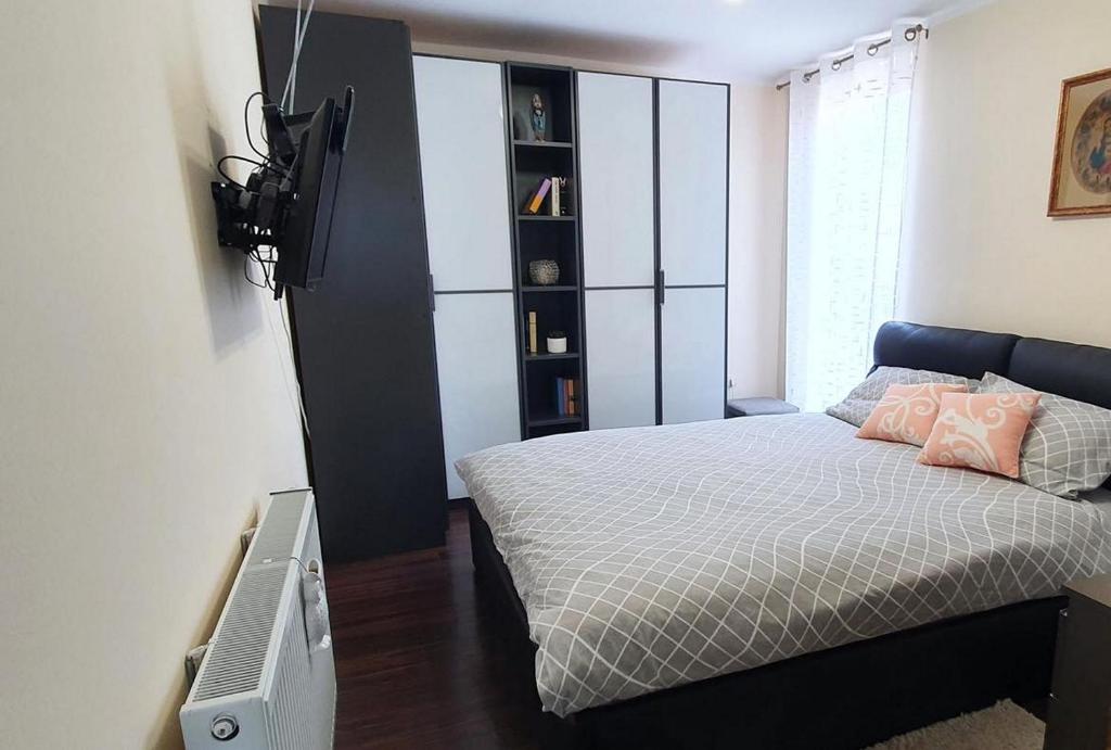 Postel nebo postele na pokoji v ubytování Apartments TB