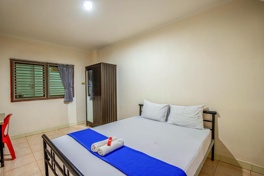 Postel nebo postele na pokoji v ubytování Hotel Bambu Kuning
