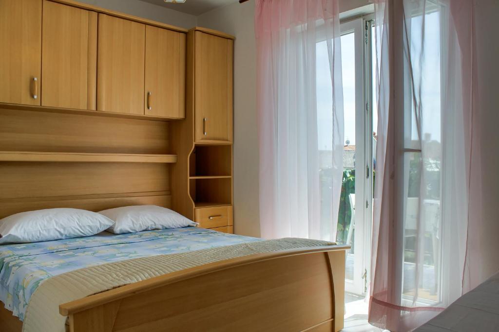 Postel nebo postele na pokoji v ubytování Apartments Sosic