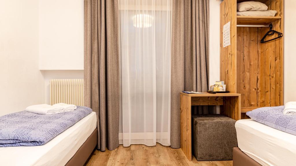 Postel nebo postele na pokoji v ubytování B&B Hotel Sonneck