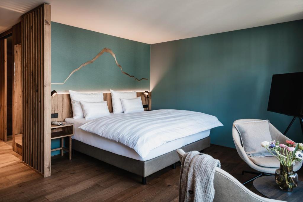 Postel nebo postele na pokoji v ubytování Berghotel Biberkopf
