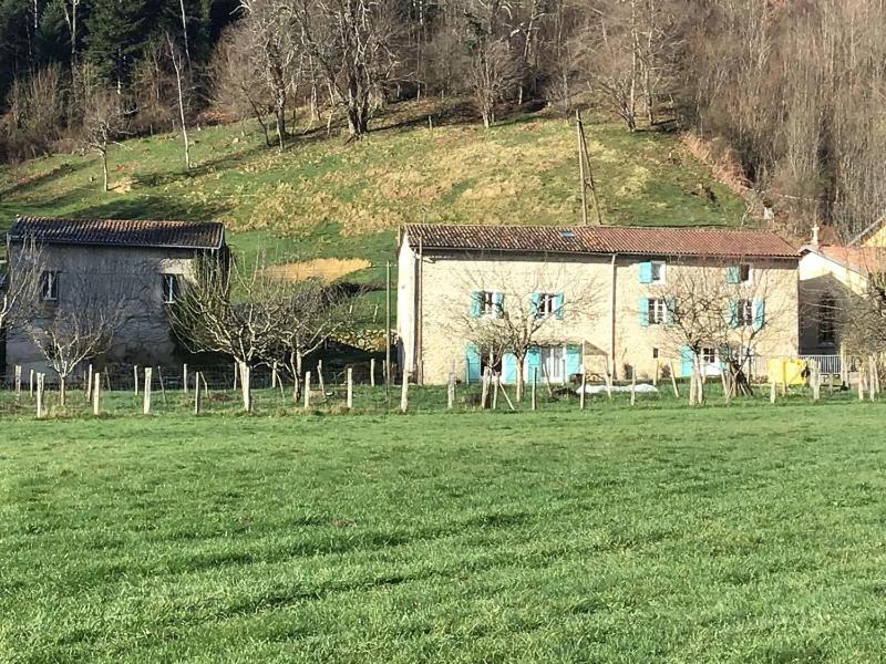 a house in the middle of a field next to a grass field at Au mohair des Alpy in Fougax-et-Barrineuf