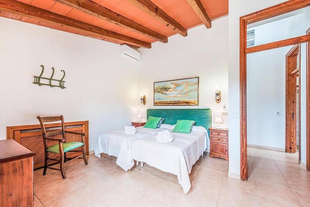 A bed or beds in a room at Finca Rafalet, Pollensa by Renthousing