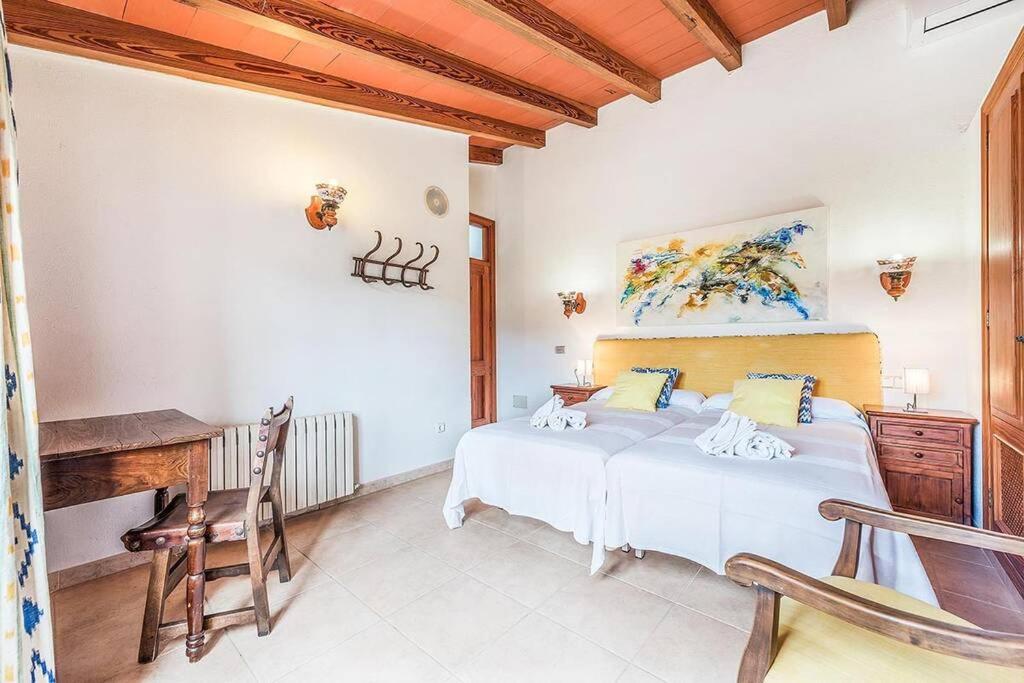 A bed or beds in a room at Finca Rafalet, Pollensa by Renthousing