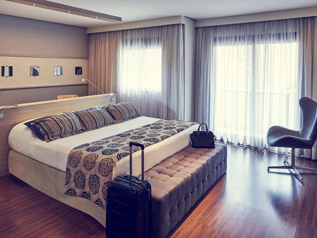 Кровать или кровати в номере Mercure Sao Paulo Pamplona
