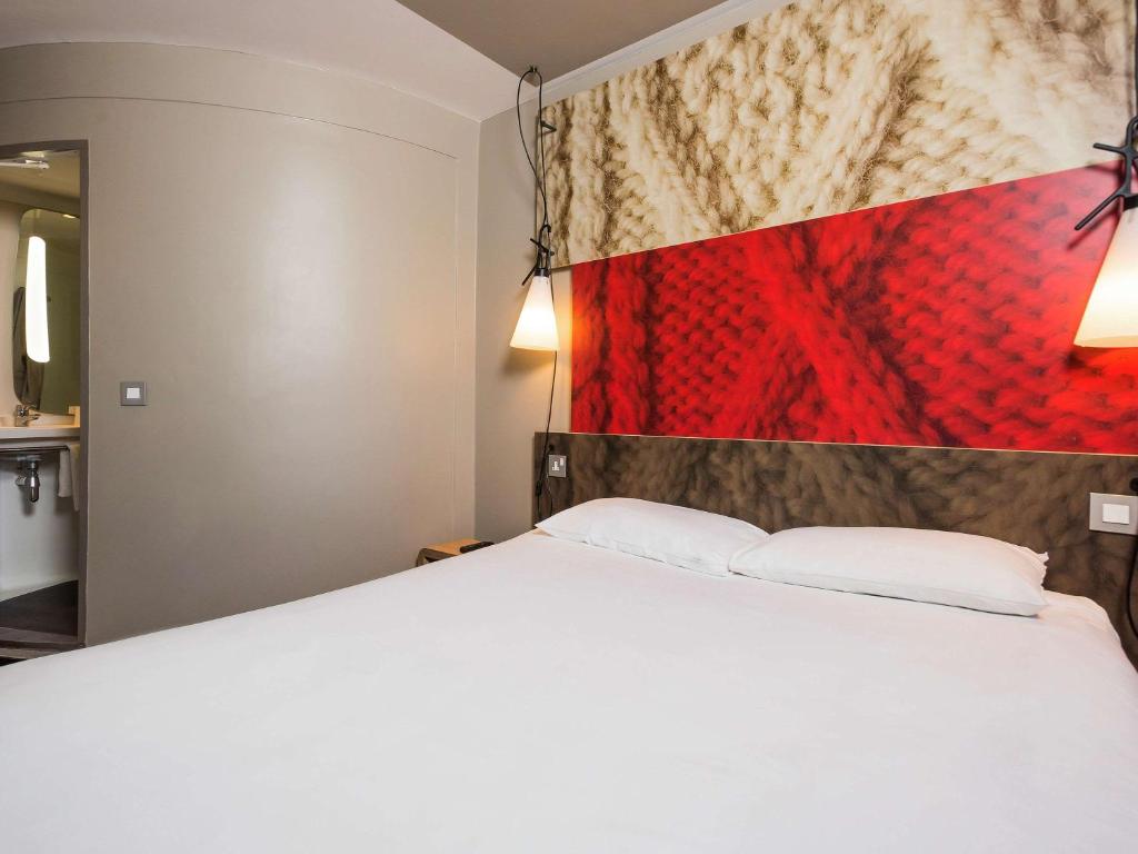 Postel nebo postele na pokoji v ubytování ibis London Excel-Docklands