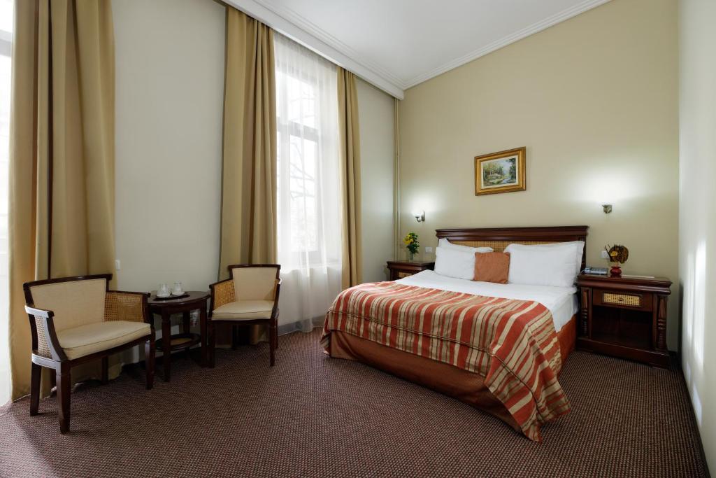 Postel nebo postele na pokoji v ubytování Atrium Hotel Ateneu City Center
