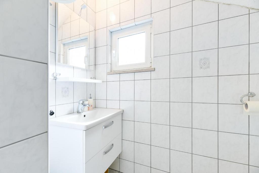 Kúpeľňa v ubytovaní Apartments Diora