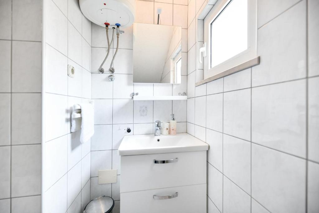 Kúpeľňa v ubytovaní Apartments Diora