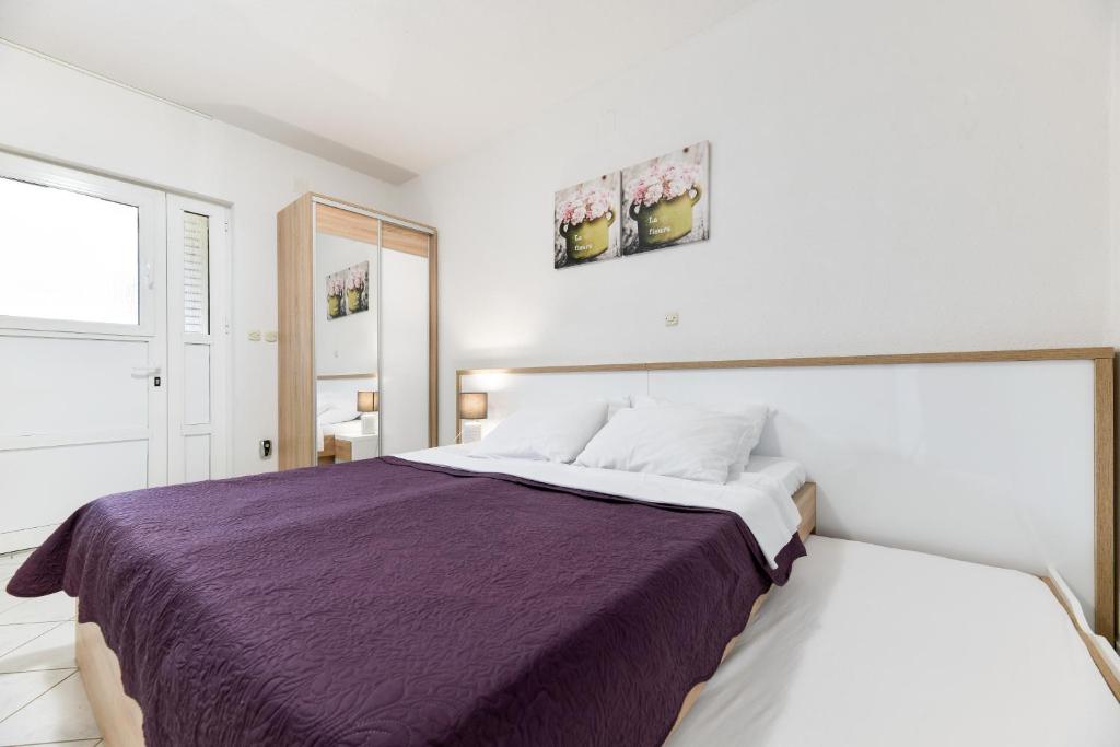 Posteľ alebo postele v izbe v ubytovaní Apartments Diora