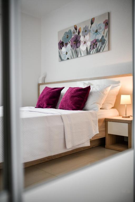 Posteľ alebo postele v izbe v ubytovaní Apartments Diora