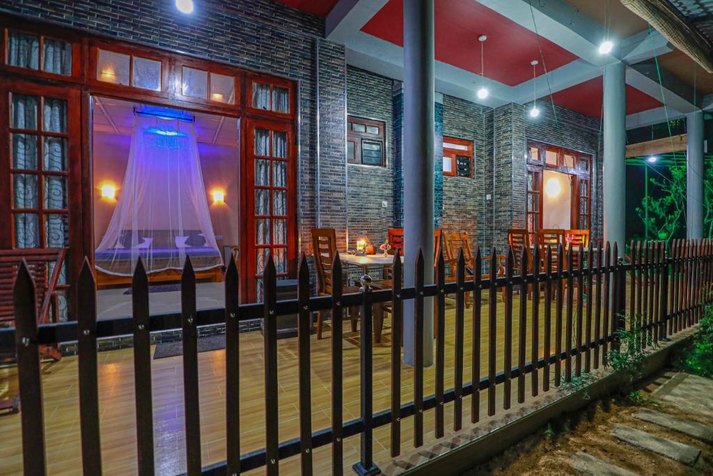 a wrought iron fence in front of a restaurant at Zircon Ella in Ella