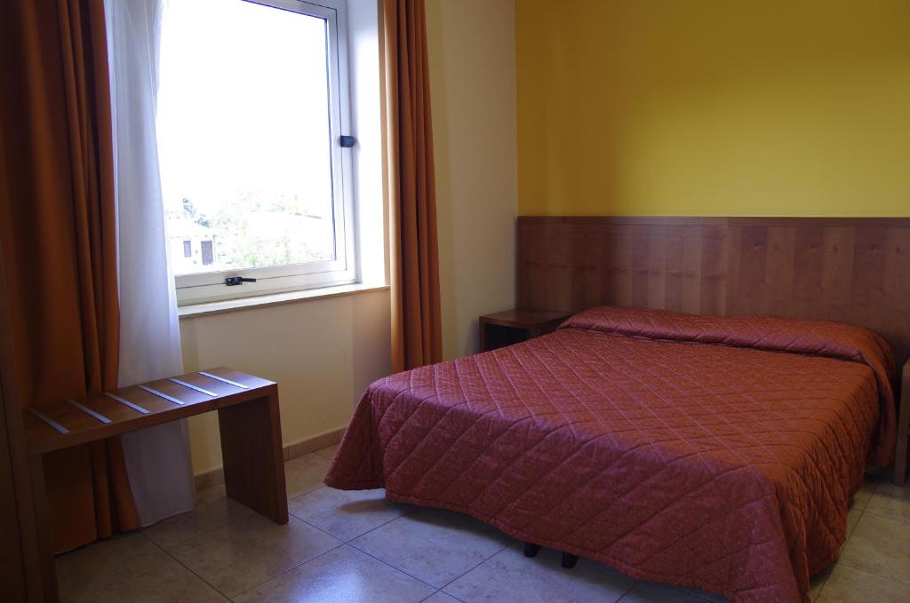 Cama ou camas em um quarto em Hotel San Martino