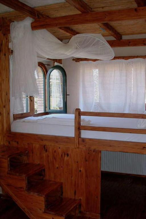 Postel nebo postele na pokoji v ubytování Castello Bellos Tower