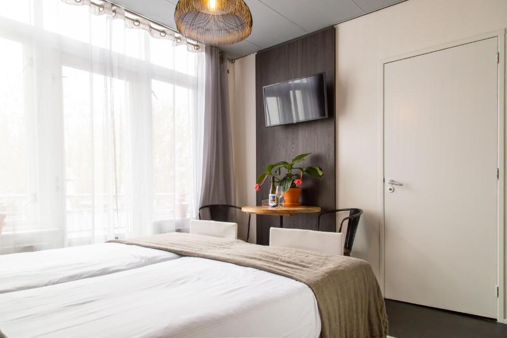 Postel nebo postele na pokoji v ubytování Hotel Pannenkoekhuis Vierwegen