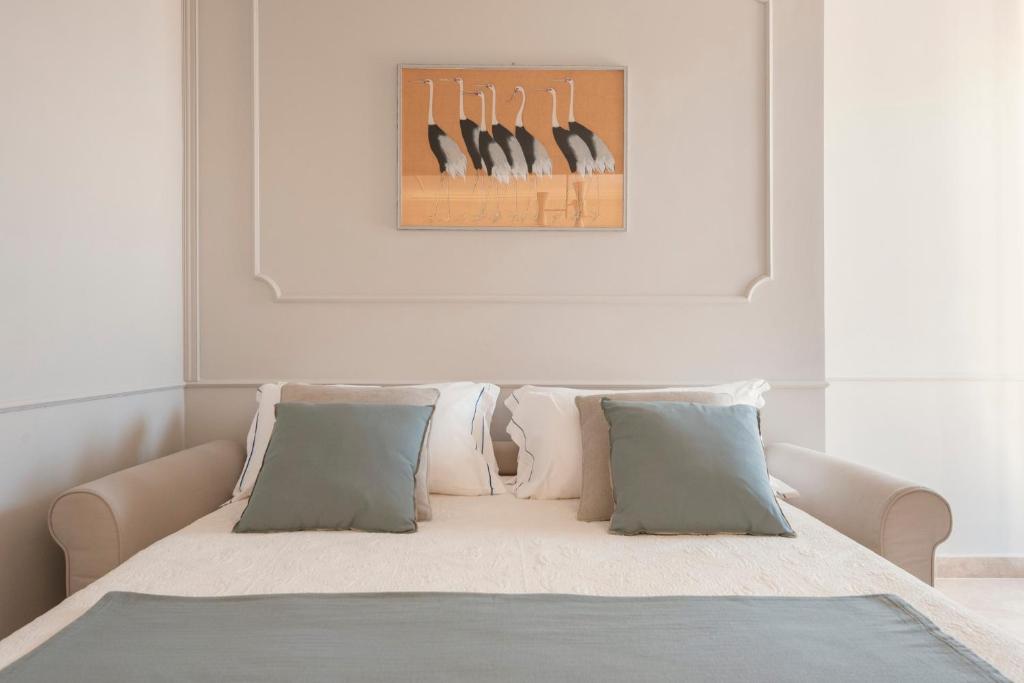 Łóżko lub łóżka w pokoju w obiekcie Antea Apartments