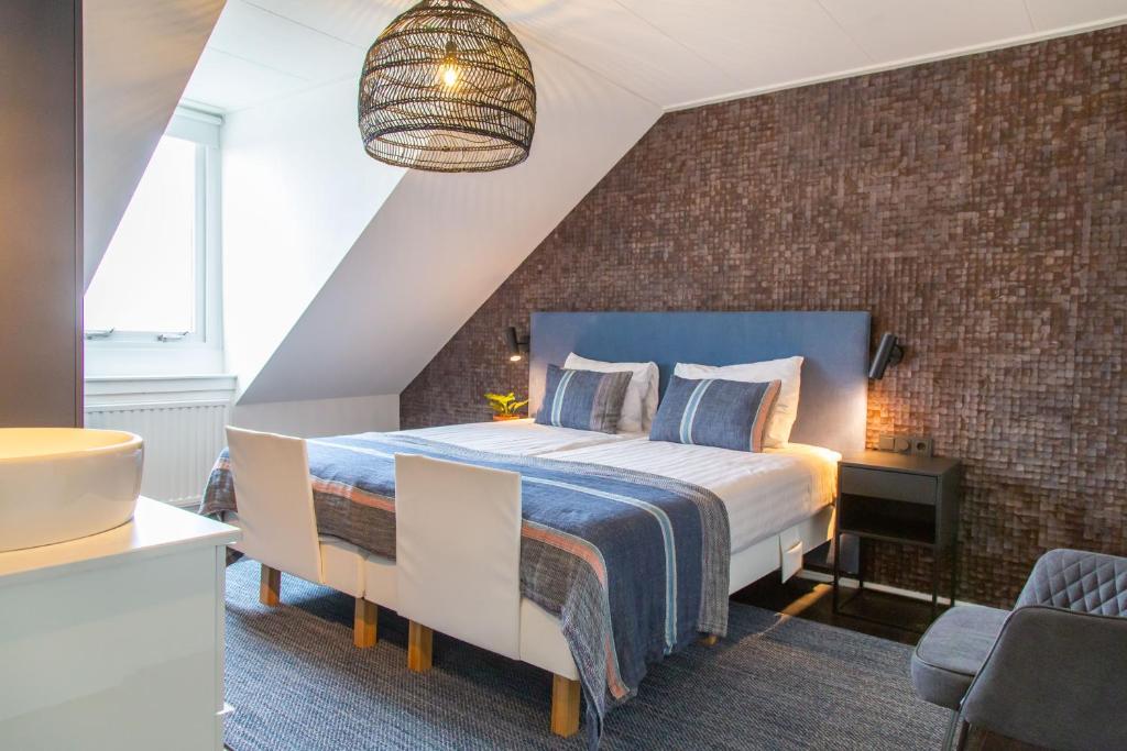 Postel nebo postele na pokoji v ubytování Hotel Pannenkoekhuis Vierwegen