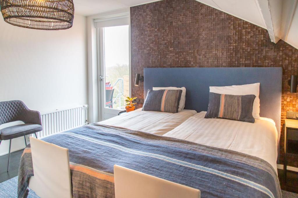 Postel nebo postele na pokoji v ubytování Hotel Pannenkoekhuis Vierwegen