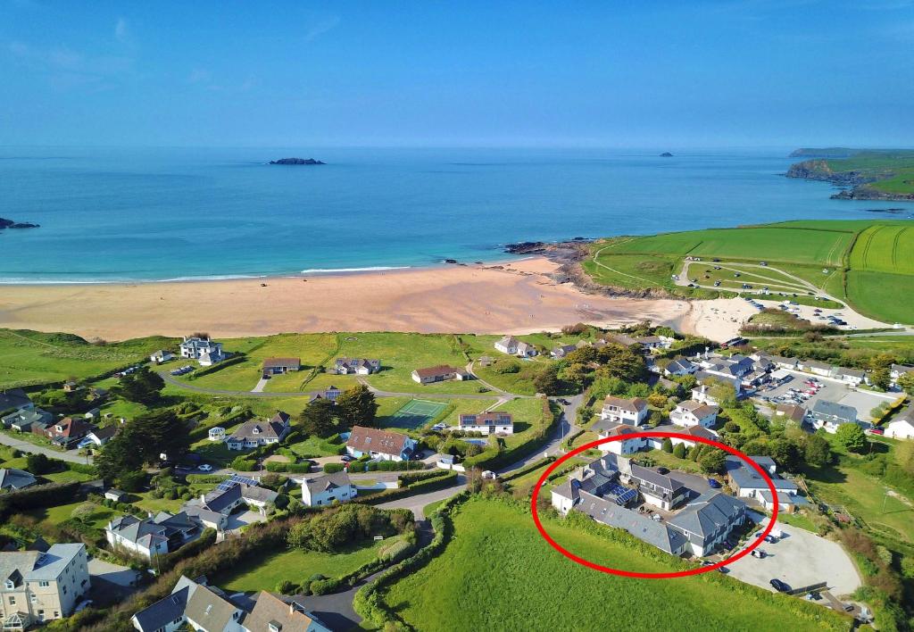 an aerial view of a house with a red circle at BY THE BEACH cottage, dogs welcome in Saint Merryn
