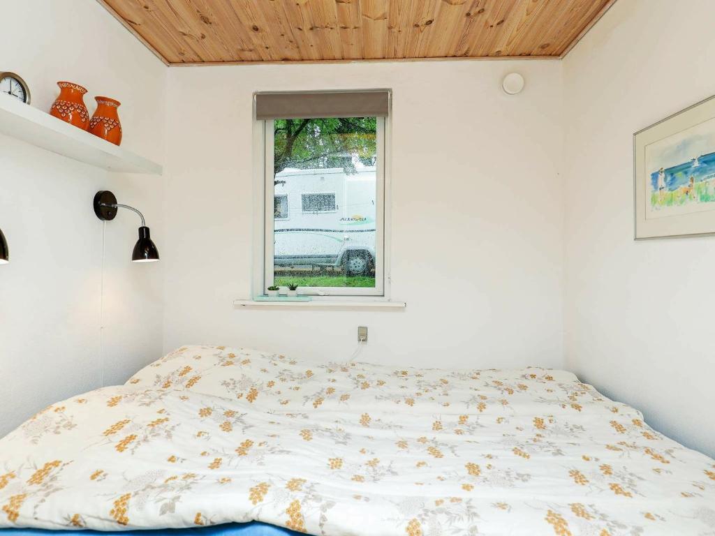 Postel nebo postele na pokoji v ubytování 4 person holiday home in Nykøbing M-By Traum