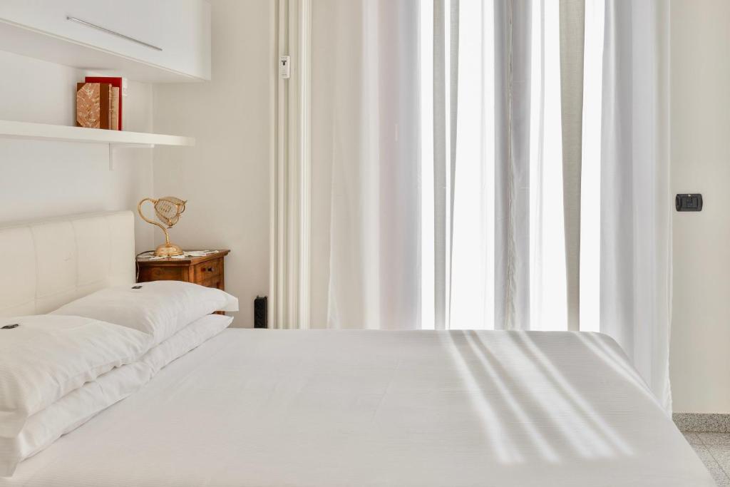 Postel nebo postele na pokoji v ubytování Aiello Suites Milan