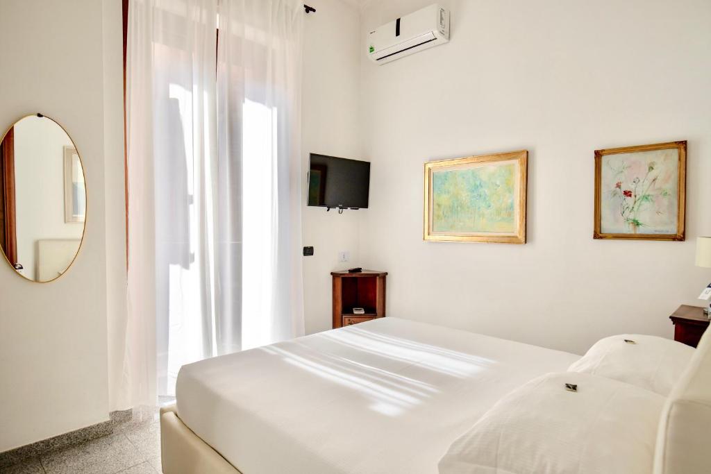 Postel nebo postele na pokoji v ubytování Aiello Suites Milan