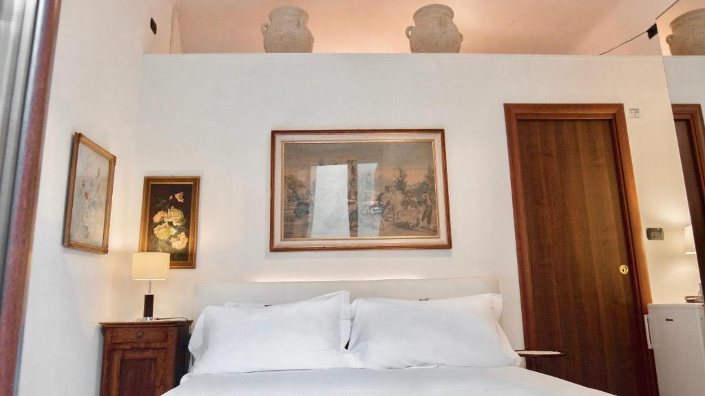 Postel nebo postele na pokoji v ubytování Aiello Suites Milan