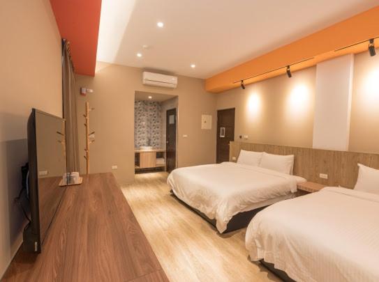 Postel nebo postele na pokoji v ubytování Yujing B&B 2