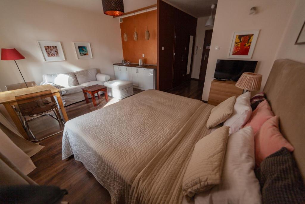 Posteľ alebo postele v izbe v ubytovaní Lounge Apartments