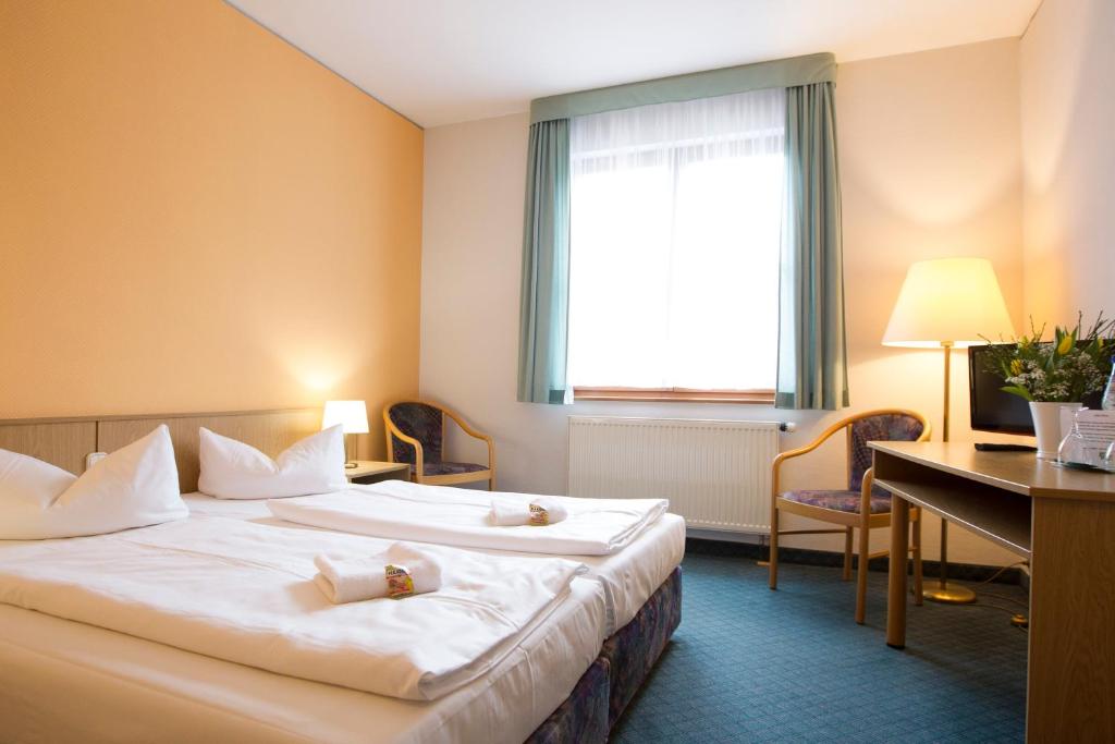 Voodi või voodid majutusasutuse Jembo Park Hotel toas