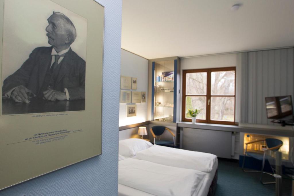 Voodi või voodid majutusasutuse Jembo Park Hotel toas