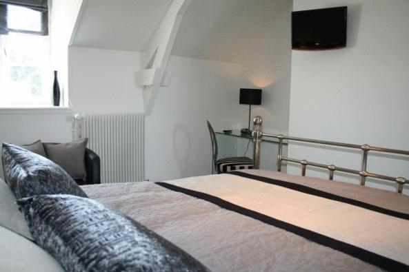 Postel nebo postele na pokoji v ubytování La Ferme des Mares, Demeures & Châteaux
