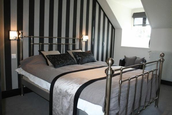 Postel nebo postele na pokoji v ubytování La Ferme des Mares, Demeures & Châteaux