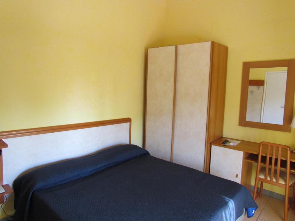 Postel nebo postele na pokoji v ubytování Hotel Villa Colombo