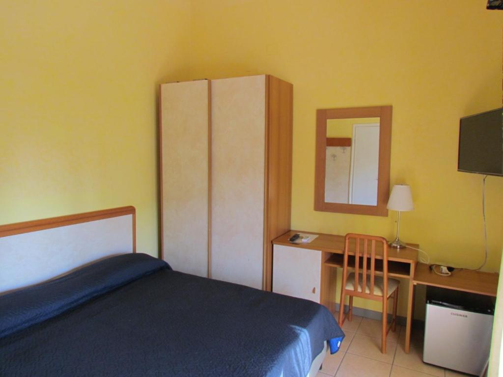 Postel nebo postele na pokoji v ubytování Hotel Villa Colombo
