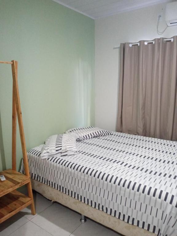 Ένα ή περισσότερα κρεβάτια σε δωμάτιο στο Loft agradável em João Pessoa, PB