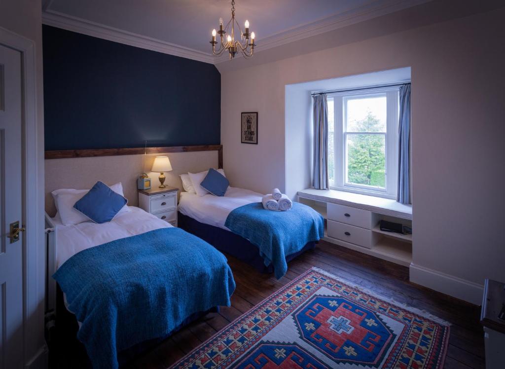 Postel nebo postele na pokoji v ubytování Craigellachie Lodge