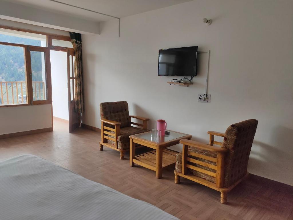 TV a/nebo společenská místnost v ubytování Hotel BHRIGU
