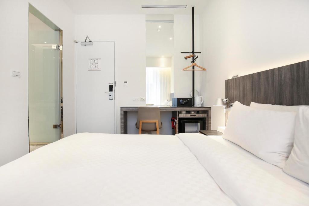 Postel nebo postele na pokoji v ubytování Dandy Hotel - Tianjin Branch
