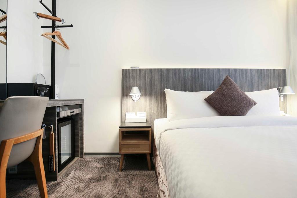 Postel nebo postele na pokoji v ubytování Dandy Hotel - Tianjin Branch