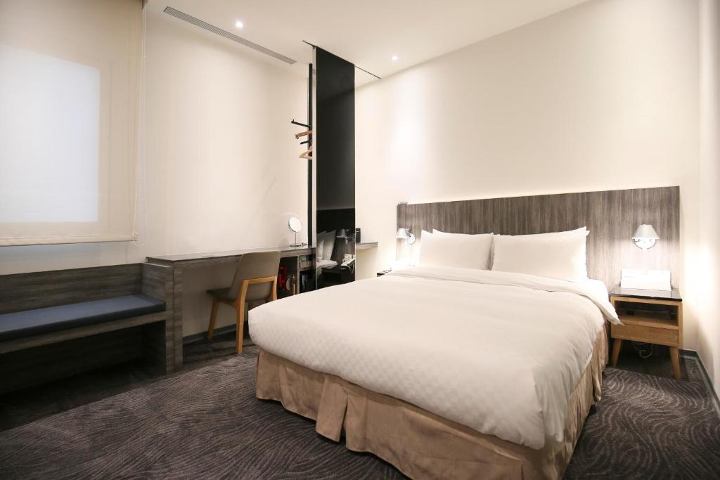 Postel nebo postele na pokoji v ubytování Dandy Hotel - Tianjin Branch