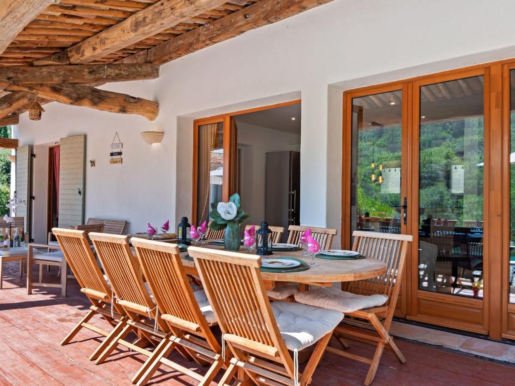 a dining room with a wooden table and chairs at VIlla in Bargemon with Private Swimming Pool in Bargemon