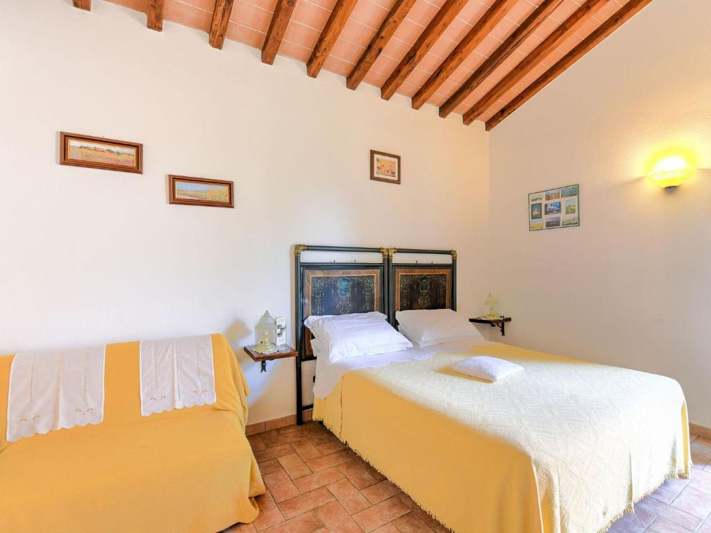 Postel nebo postele na pokoji v ubytování Holiday Home in Tuscany with Pool