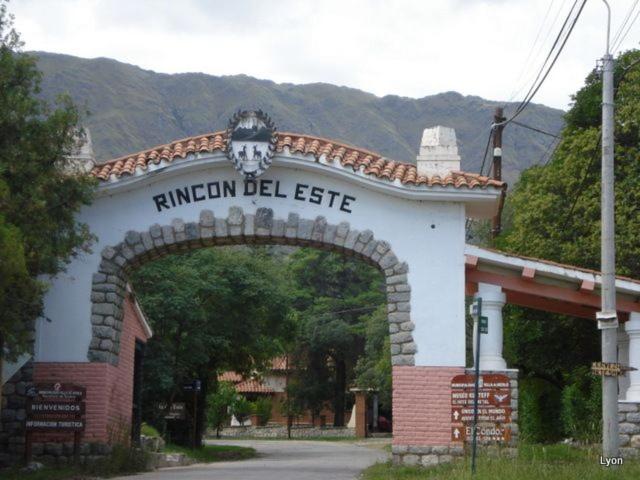 an entrance to a building with a sign on it at La Luisa in Merlo