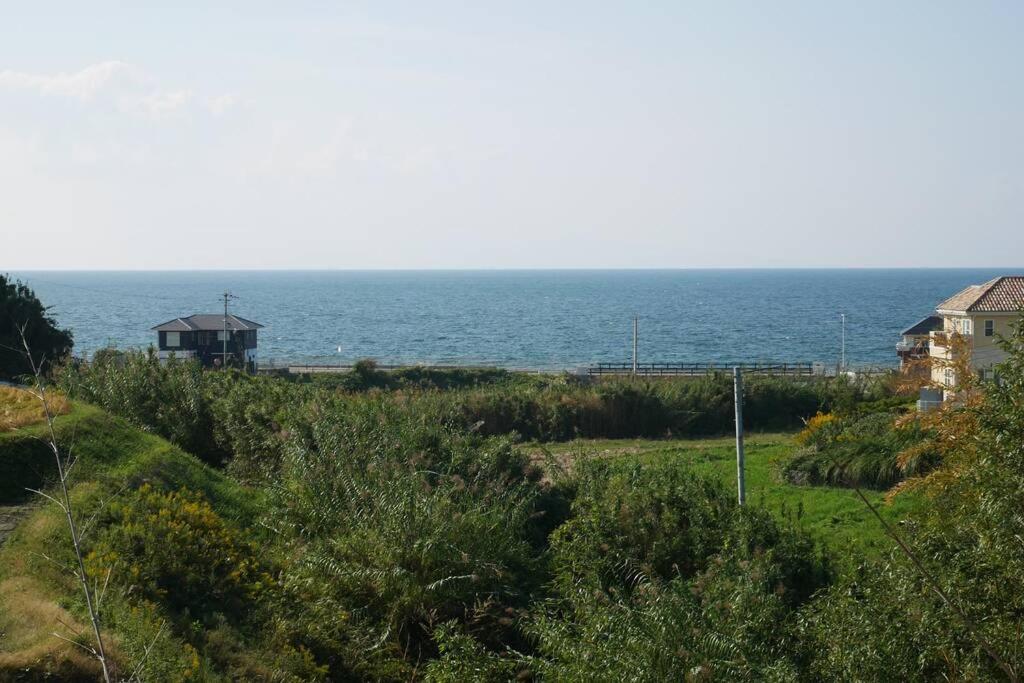 a view of the ocean from a house at 民泊 桔梗 in Awaji