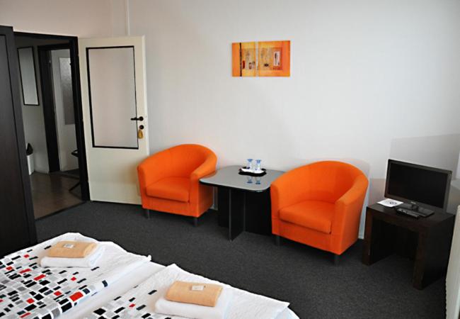 Postel nebo postele na pokoji v ubytování Hotel Milotel