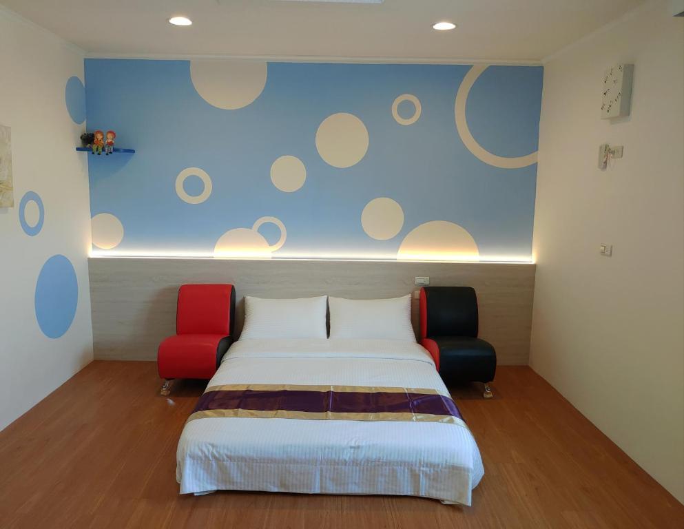 Postel nebo postele na pokoji v ubytování Purple Shell Homestay
