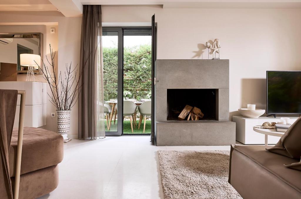Televízia a/alebo spoločenská miestnosť v ubytovaní Elaia Luxury Condo Glyfada