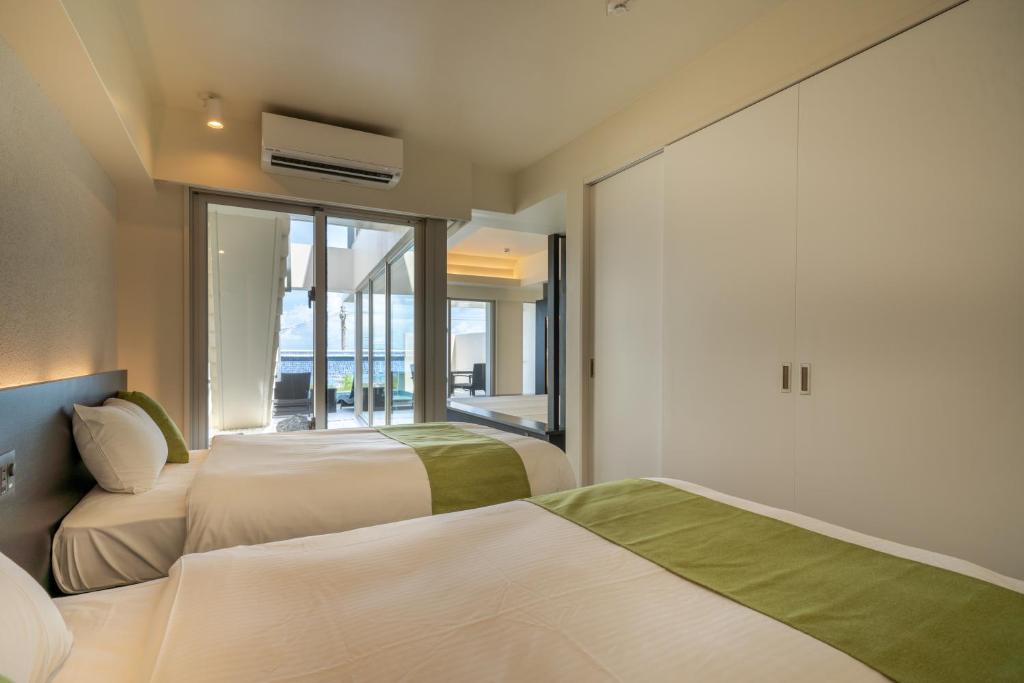 Ein Bett oder Betten in einem Zimmer der Unterkunft KEN KEN VILLA YUUMODORO