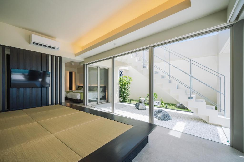 Ein Bett oder Betten in einem Zimmer der Unterkunft KEN KEN VILLA YUUMODORO